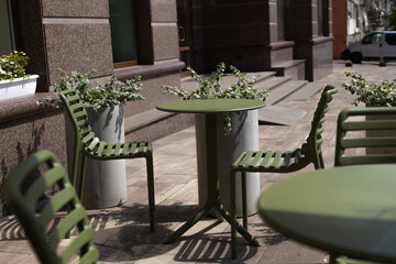 khaki chairs and tables, summer terrace of the cafe