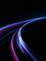 Abstract light trails flow across a dark background creating a dynamic effect.