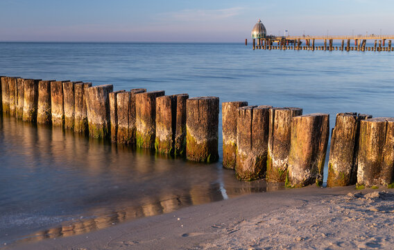 wooden planks at the Baltic Sea in Zingst, Germany at sunset, photographed with longtime exposure