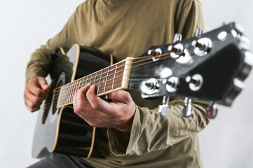 Person Playing Acoustic Guitar, Close-up on Hands and Strings