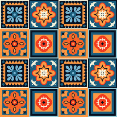 Seamless talavera pattern repeating orange and blue floral motifs on ceramic tiles, celebrating mexican and spanish heritage