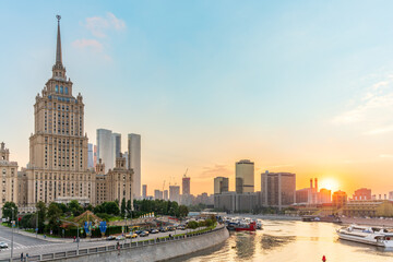 High-rise stalinist building near river at summer sunset in Moscow, Russia. Historic name is Hotel...