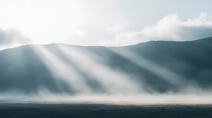 Obraz premium The sun is shining on a mountain, creating a beautiful and serene atmosphere