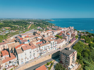 Italy, July 03, 2025: Aerial drone view of San Vito Chietino, a seaside resort on the Trabocchi coast. Here the sea is crystal clear and the area is very relaxing and full of tourists