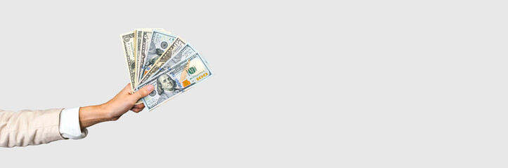 Long Banner with Hand Holding US Dollars for Financial Designs