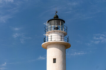 White Lighthouse Tower Against a Clear Blue Sky on Lefkada