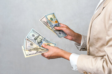 Successful Investments: Hands Holding Stacks of Profit Money