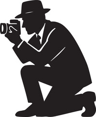Man in hat and suit kneeling to take a photo with a camera silhouette