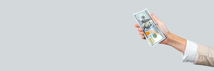Long Horizontal Banner with Hand Holding US Dollars