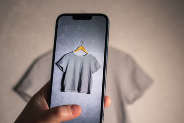 Female influencer prepares used garments for resale. Online second hand shop. Fashion circulation.