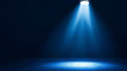 A blue light is shining on a dark background