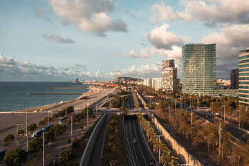 Barcelona Urban Coastline: Beach, Cityscape, and Distant Mountains

An aerial view of Barcelona's...