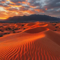 Fototapete Bordeaux Sunrise over vibrant dunes. Dramatic desert landscape at dawn, with warm colors and textured sand formations.  Mountains in the background  © Fotocopi