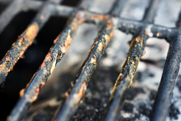 Macro view of dirty gas grill grate