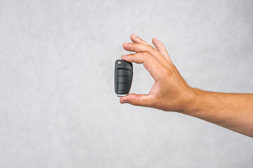 Car Alarm Security: Hand Holding Remote for Vehicle Protection