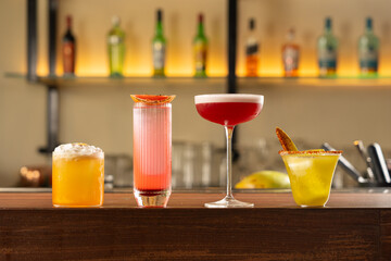 Group of Cocktail in a Line on a Bar Counter, Coconut Foam Cocktail, Grapefruit Cocktail, Strawberry Cocktail, Green Mango Cocktail