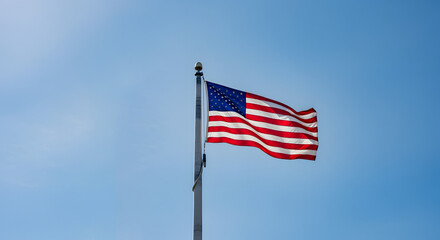 Fototapeta premium American Flag Waving: Clear Blue Sky