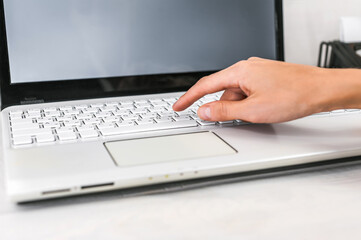 Finger on Laptop Keyboard: Focused Typing and Digital Work