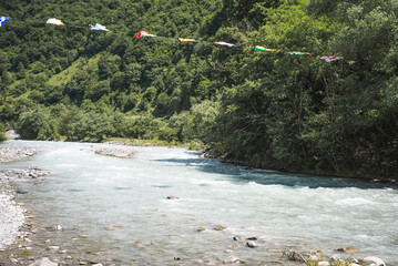 A small waterfall among the rocks on the mountain river in Georgia. Panoramic picture.