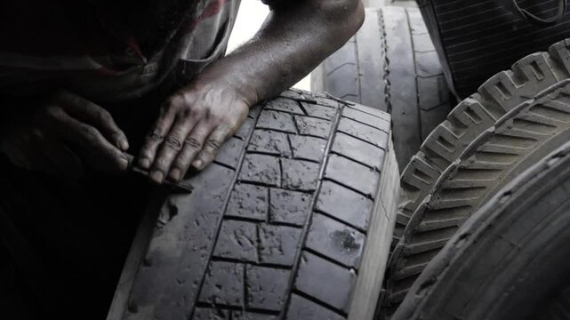 Mastering the Art of Tire Maintenance - Expert Hands at Work
