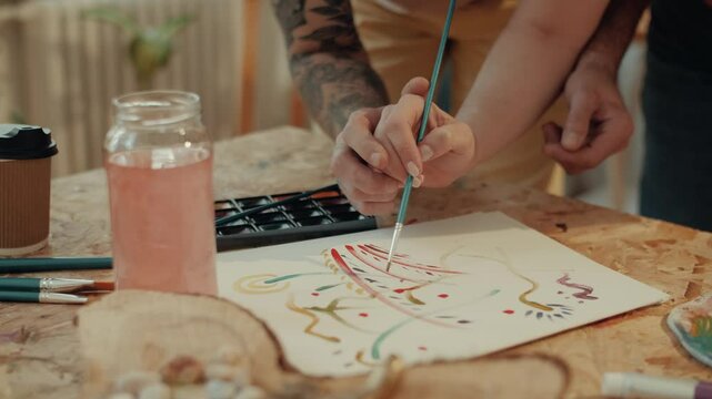 Couple painting together and having fun