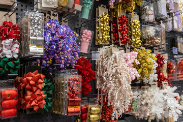 Vibrant collection of festive gift bows and decorative ribbons beautifully displayed in a retail...
