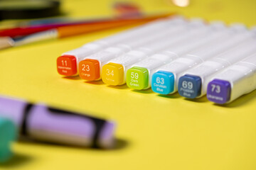 Vibrant alcohol art markers displaying a spectrum of colors like Watermelon Red, Orange, and...