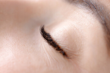 Close-up of eyelash extensions on caucasian female adult eye