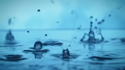 Water droplets impacting and splashing surface, blue hue and soft focus, macro shot - Powered by Adobe