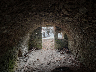 Interior of a rustic stone cellar in the Bükk Mountains, once part of a glassworks site. The...