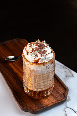Salted Caramel Mocha Dessert Drink with Cream and Chocolate in Frosted Glass