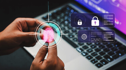 A hand interacts with a glowing pink fingerprint scan on a holographic interface amid dark purple panels and blurred laptop keyboard background