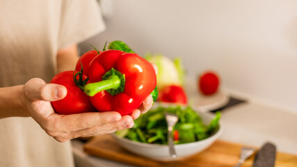  Boy choosing fresh vegetables to prepare vegetarian salad, healthy eating of teenager