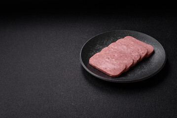 Food, meat, ham sliced in slices for the festive table. Spiced ham