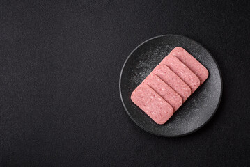 Food, meat, ham sliced in slices for the festive table. Spiced ham