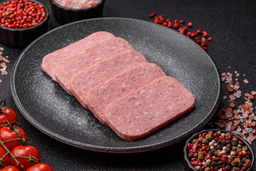 Food, meat, ham sliced in slices for the festive table. Spiced ham