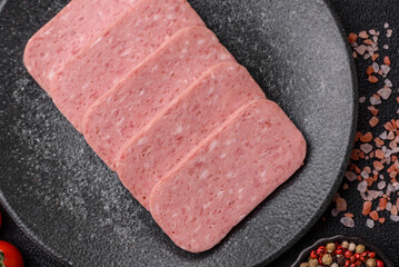 Food, meat, ham sliced in slices for the festive table. Spiced ham