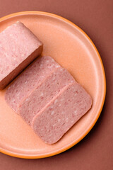 Food, meat, ham sliced in slices for the festive table. Spiced ham