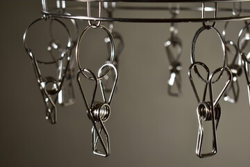 Metal clothespins for drying clothes indoors.