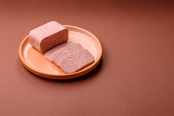 Food, meat, ham sliced in slices for the festive table. Spiced ham