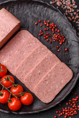 Food, meat, ham sliced in slices for the festive table. Spiced ham