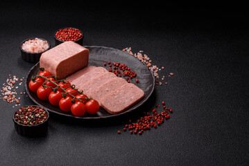 Food, meat, ham sliced in slices for the festive table. Spiced ham