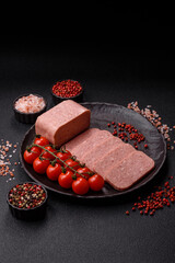 Food, meat, ham sliced in slices for the festive table. Spiced ham