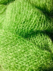 Green mohair fabric texture close-up