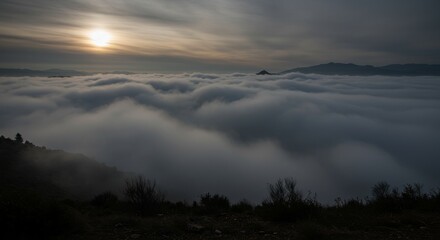 Obraz premium Sun Setting Over a Sea of Clouds - A breathtaking sunset view of a vast expanse of clouds, symbolizing mystery, serenity, vastness, tranquility, and ethereal beauty