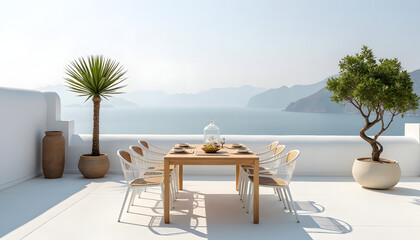 Beautiful outdoor dining table overlooking the sea and distant mountains on a sunny day.