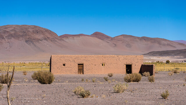 Remote adobe house in arid landscape of La Puna, Argentina