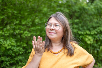 Happy mature woman with long hair smiling, positive emotion, self care, natural aging beauty,...