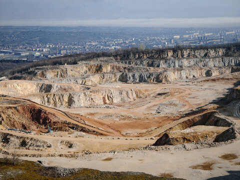 Terraced slopes of the disused Nagy-kőm&aacute;zsa quarry overlook the city of Miskolc, Hungary. A striking industrial landscape now slowly reclaimed by nature.