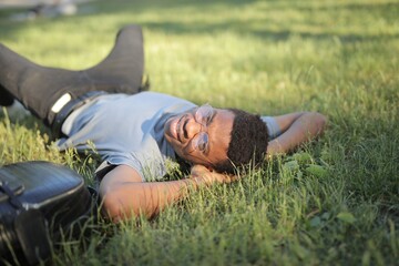 young man lying on the grass